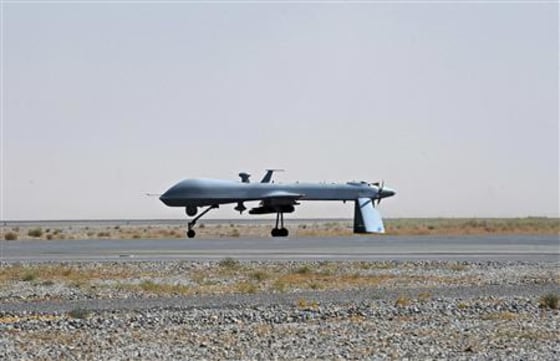 File photo of U.S. Predator unmanned drone armed with a missile on the tarmac of Kandahar military airport