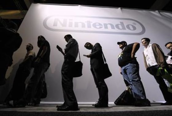 Attendees wait in line at the Nintendo display at the E3 Media & Business Summit in Los Angeles
