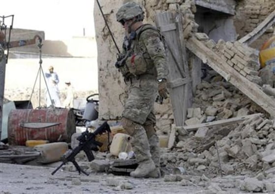 A US soldier arrives at the site of an explosion in Kandahar city