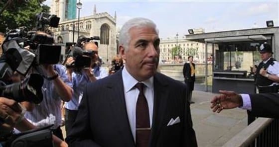 Mitch Winehouse, the father of deceased British singer Amy Winehouse, arrives at the Houses of Parliament in London