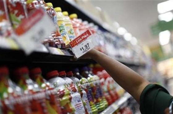 A Walmart employee stocks shelves in a newly opened Walmart Neighborhood Market in Chicago