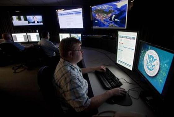 Analysts work in a watch and warning center of a cyber security defense lab at the Idaho National Laboratory