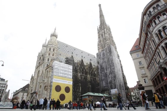 Banner with a symbol of blind people is fixed to St. Stephen's Cathedral in Vienna.