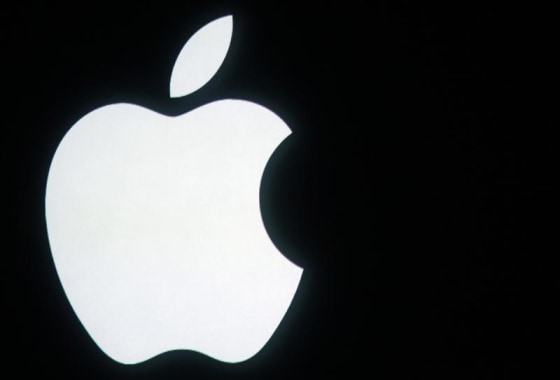 The Apple logo is displayed onstage before a product unveiling event at Apple headquarters in Cupertino