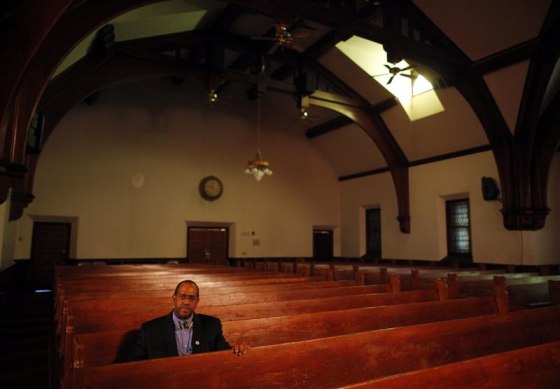 Reverend Gregory G. Groover sits for a portrait inside the Charles St. AME Church in the Roxbury neighborhood of Boston