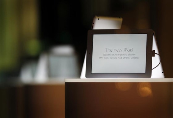 New iPad tablets are seen in a window display in an Apple store in Sydney