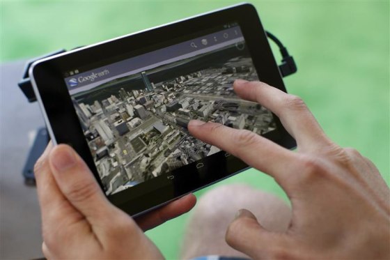 An attendee uses Google Map on a Google Nexus 7 tablet during Google I/O 2012 Conference at Moscone Center in San Francisco