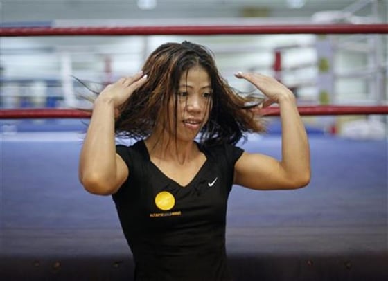 India's boxer MC Mary Kom gestures during an interview with Reuters in Pune