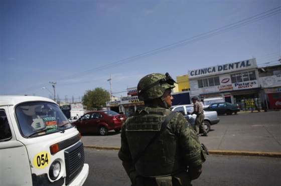 Soldier stands guard on street in neighbourhood of Nezahualcoyotl in Mexico City