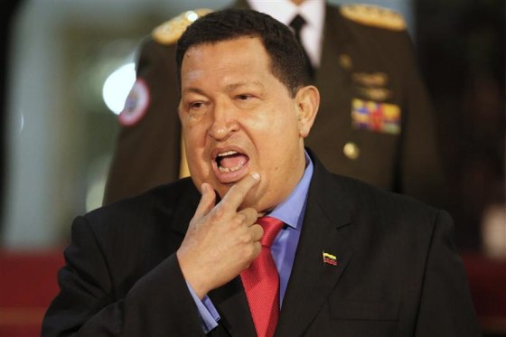 Venezuela's President Chavez stands after receiving a Russian delegation at Miraflores Palace in Caracas