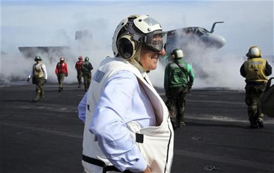 U.S. Defense Secretary Panetta watches day flight operations from the flight deck of the aircraft carrier USS Enterprise, off the coast of Georgia