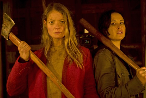 Sarah Allen, left and Tommie-Amber Pirie in "The Retreat" play a couple who spend a romantic weekend at a remote cabin in the woods. They end up having to fight for their lives.