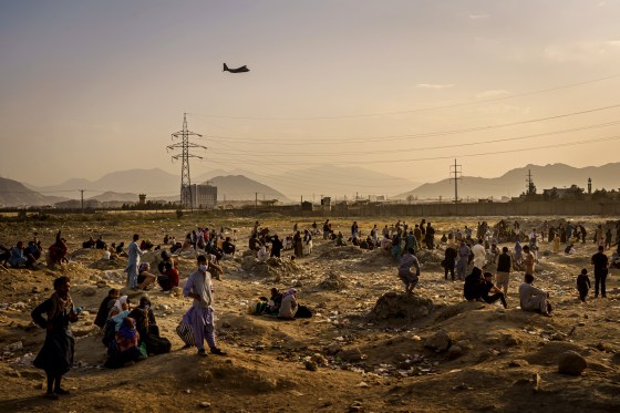 A military transport plane takes off while Afghans who cannot evacuate are stranded in Kabul on Aug. 23, 2021.