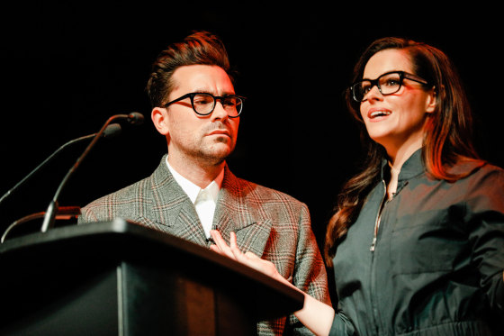 Dan Levy and Emily Hampshire speak at a benefit on April 12, 2018, in Toronto, Canada.