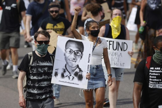Demonstrators march over the death of Elijah McClain in Aurora, Colo., on June 27, 2020.