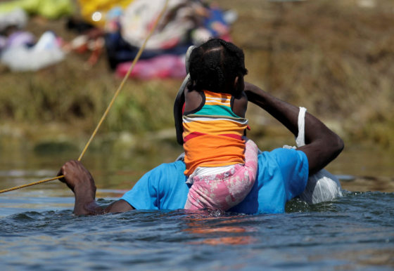 Image: Migrants seeking refuge in the U.S. cross Rio Grande river, in Ciudad Acuna