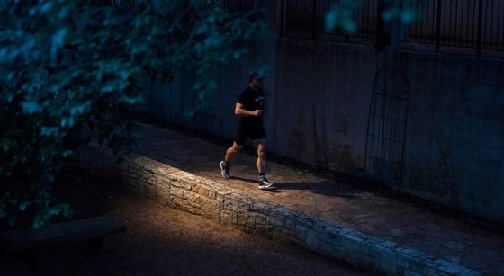 A jogger on the river walk in San Antonio, Texas.