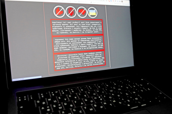 Image: A laptop screen displays a warning message on the official website of the Ukrainian Foreign Ministry, in this illustration