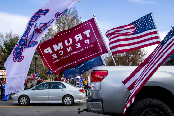 Trump flags are seen during the rally. Pro Trump supporters