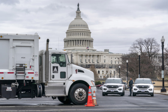 Heavy vehicles are set near the entrance to Capitol Hill on Tuesday amid reports that trucker protests will arrive on March 1, the day of President Joe Biden's State of the Union address.