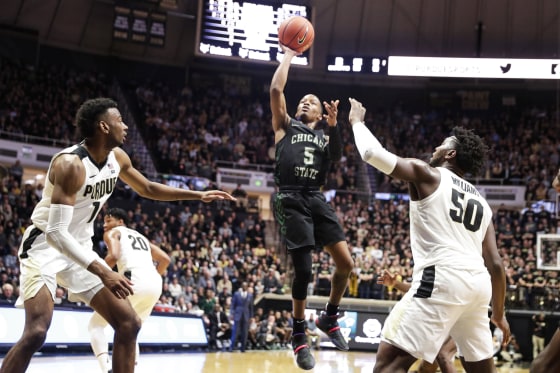 Chicago State guard Xavier Johnson shoots between Purdue forwards Aaron Wheeler and Trevion Williams during the first half of an NCAA college basketball game in West Lafayette, Ind., on Nov. 16, 2019.