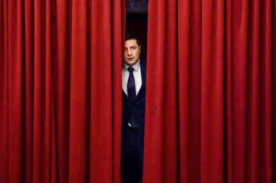 Ukrainian comic actor and then-presidential candidate Volodymyr Zelensk7y enters a hall in Kyiv on March 6, 2019, to take part in the shooting of the television series "Servant of the People" where he plays the role of the President of Ukraine.