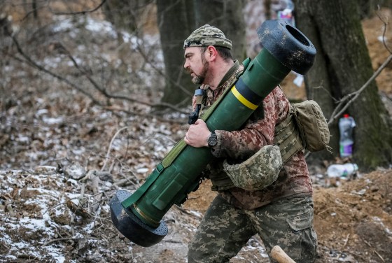 A Ukrainian service member holds a Javelin missile system at a position on the front line in the north Kyiv region on March 13, 2022.