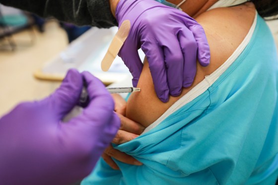 A medical worker prepares to administer a Covid-19 vaccination at Northern Navajo Medical Center on Dec. 15, 2020, in Shiprock, N.M.