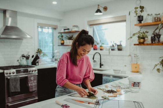April Julian working on a ramen cake.
