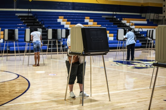 People cast their votes in privacy during election day at the Warrensville Heights Recreation Center in Warrensville, Ohio on Aug. 3, 2021.