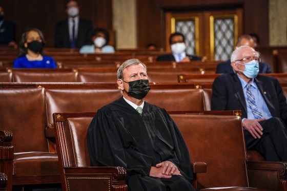 Chief Justice John G. Roberts Jr. listens as President Joe Biden addresses a joint session of Congress at the Capitol on April 28, 2021.