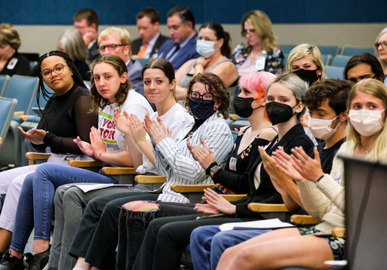 Lyman High School students, with students from other Seminole County high schools, applaud remarks supporting their position during a meeting of the Seminole County School Board on May 10, 2022, in Seminole County, Fla.