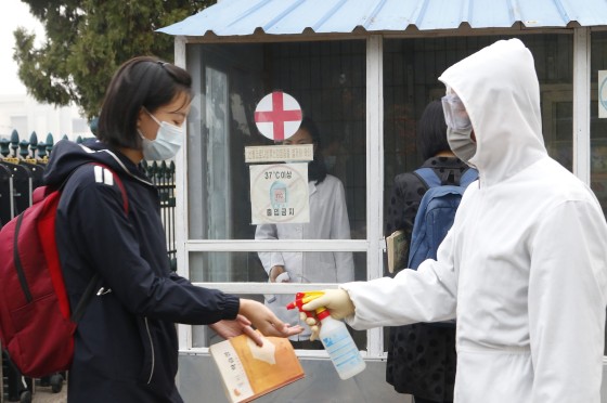 A student’s hands are disinfected at a school in Pyongyang, North Korea, last year.