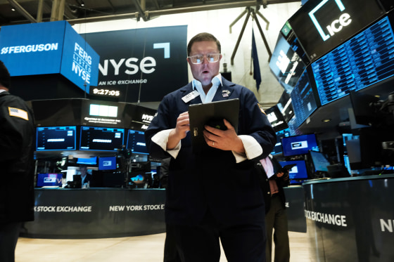 A traders works on the floor of the New York Stock Exchange