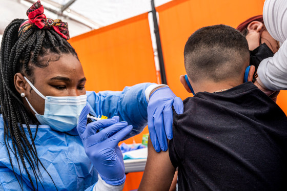 A healthcare worker administers a Pfizer-BioNTech Covid-19 vaccination to a child in San Francisco on Jan. 10, 2022.