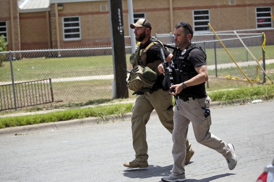Police outside Robb Elementary School following a shooting, in Uvalde, Texas, on May 24, 2022.