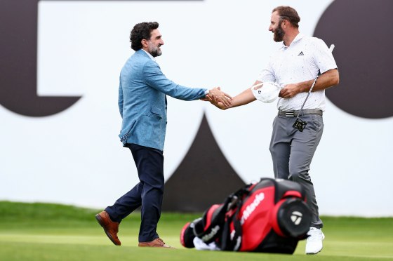 Dustin Johnson of the U.S. USA shakes hands with Yasir Al-Rumayyan