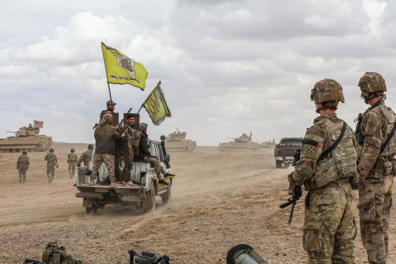 U.S. soldiers conduct live fire exercises alongside the Syrian Defense Forces in Syria, on March 25, 2022.