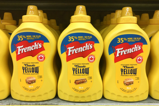 Yellow plastic squeeze bottles of French's mustard sauce