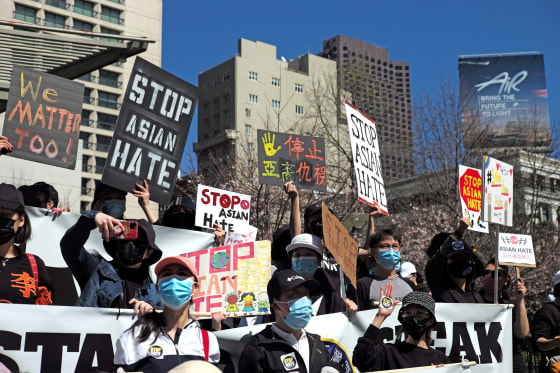 People take part in a rally against racism and violence on Asian Americans
