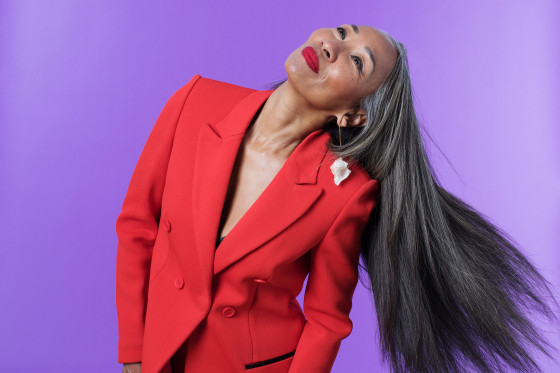 Portrait of Older Confident Woman Swaying Her Hair