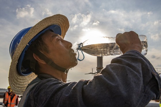 A construction worker cools off during a heat wave in Chongqing, China, on July 11.