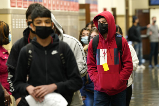 Students at Wyandotte County High School in Kansas City, Kan., walk through a hallway on March 31, 2021.