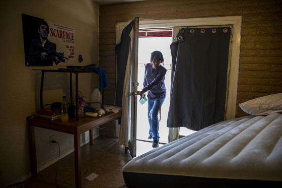 A condo complex manager walks into one of the units that was served an order of eviction
