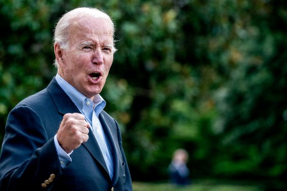 President Joe Biden answers a shouted question from a reporter while walking to Marine One on the South Lawn of the White House on Aug. 7, 2022.