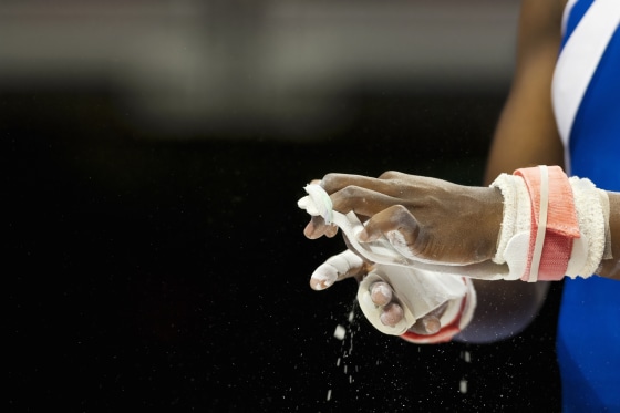 Image: A female gymnast prepare for a competition
