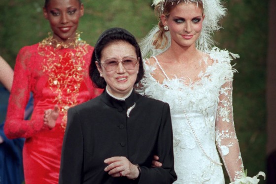 Japanese fashion designer Hanae Mori, center, is applauded by models after the presentation of her 1997-98 fall-winter haute couture collection in Paris.