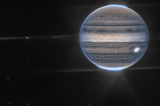 In this wide-field view, Webb sees Jupiter with its faint rings, which are a million times fainter than the planet, and two tiny moons called Amalthea and Adrastea.