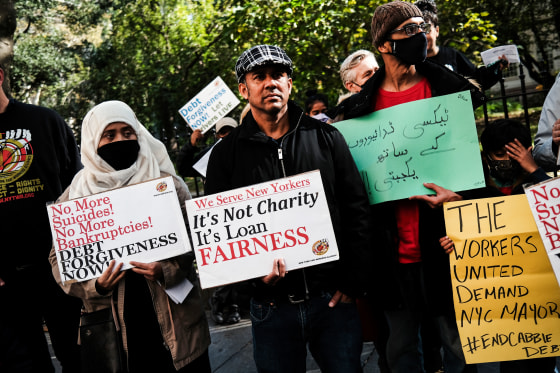 New York City taxi drivers and their supporters demand debt relief at a rally during the second week of a hunger strike outside City Hall on Oct. 31, 2021.
