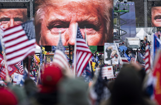 President Donald Trump appears on video screens before his speech to supporters from the Ellipse at the White House on Jan. 6, 2021.